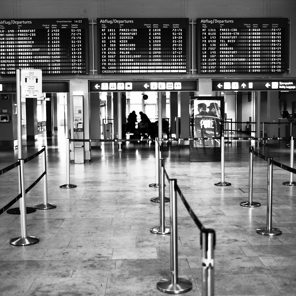 Black and white photo of airport security area.
