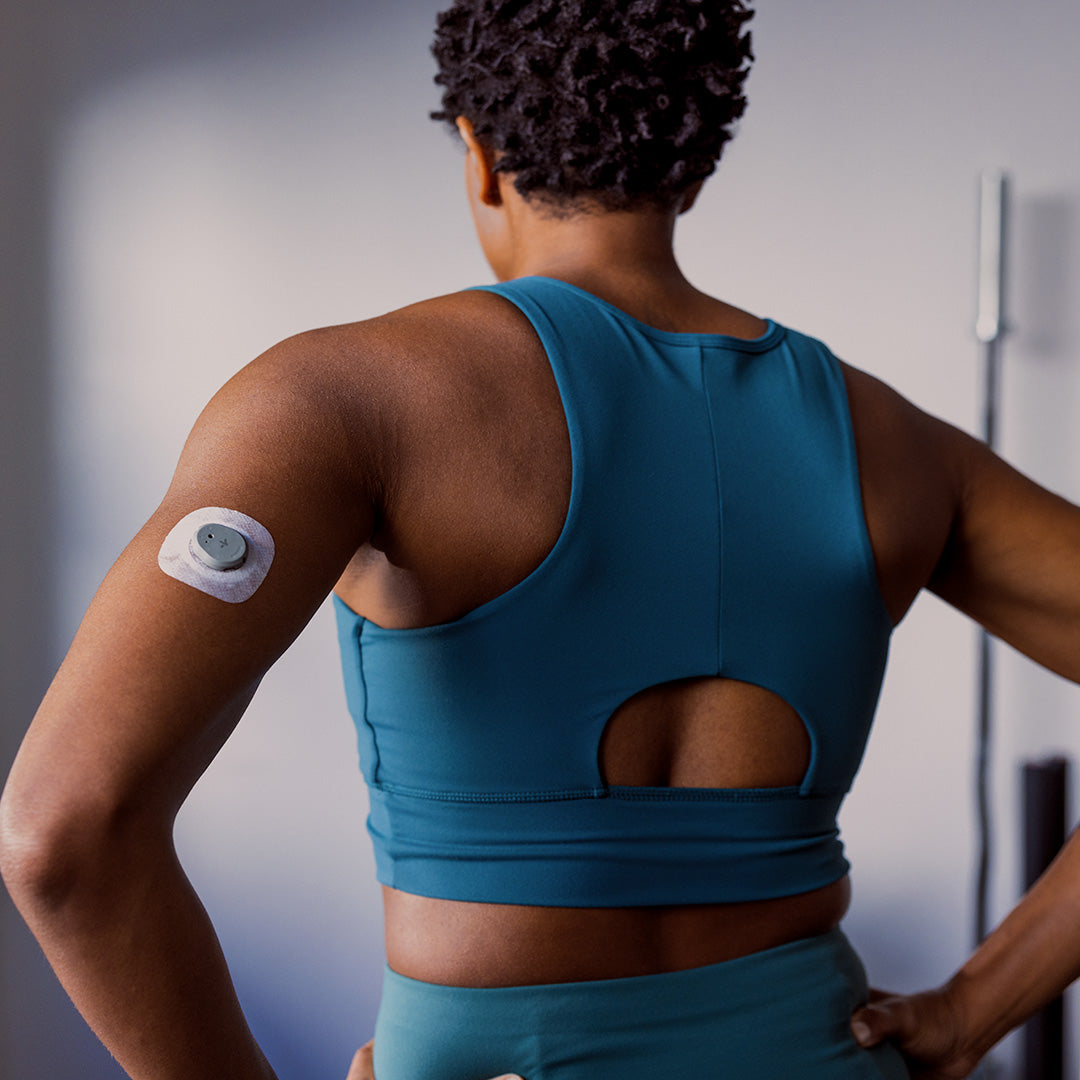 Femail working out wearing Dexcom sensor