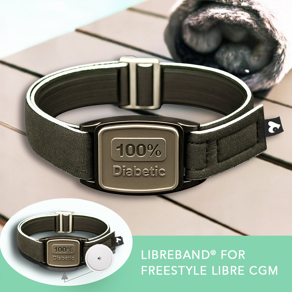 Armband with &#39;100% Diabetic&#39; label on a wooden surface, featuring the Libreband for Freestyle Libre CGM.