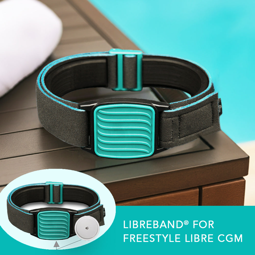 Libreband in teal with wave design on cover for Freestyle Libre sensor. Towel and swimming pool background.
