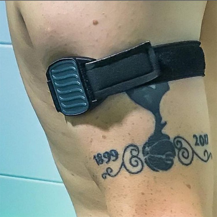 Dexband CGM armband for Dexcom with pewter wave cover and black neoprene strap worn on upper arm, customer review photo