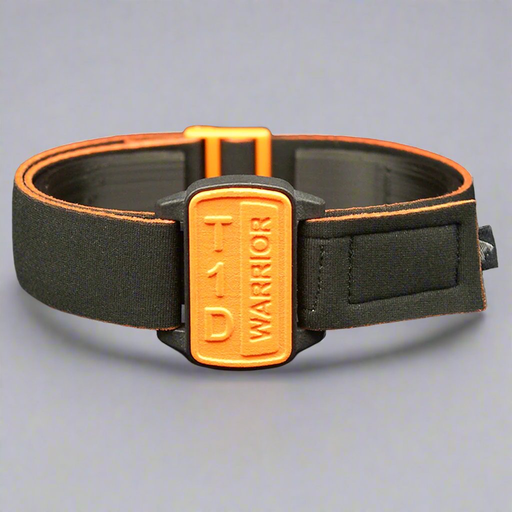 Dexband armband cover in orange with motif T1D Warrior. Black strap edged in coordinating orange.