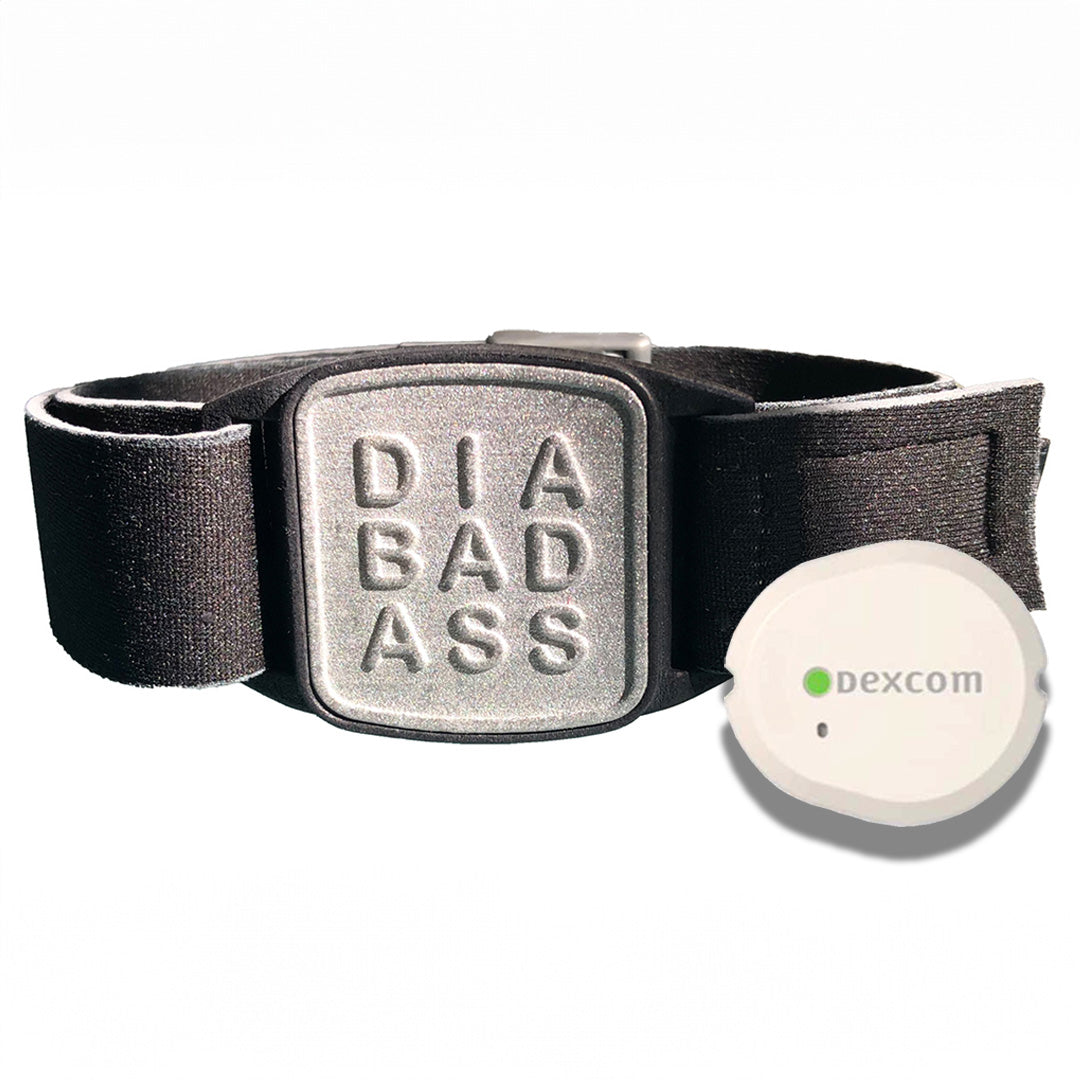 Dexband armband for Dexcom G7 CGM. Black strap with pewter DIABADASS cover with swimming pool in background.