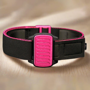 Dexband CGM armband for Dexcom G6 and ONE+ with magenta wave cover and water-resistant neoprene strap on wooden table.