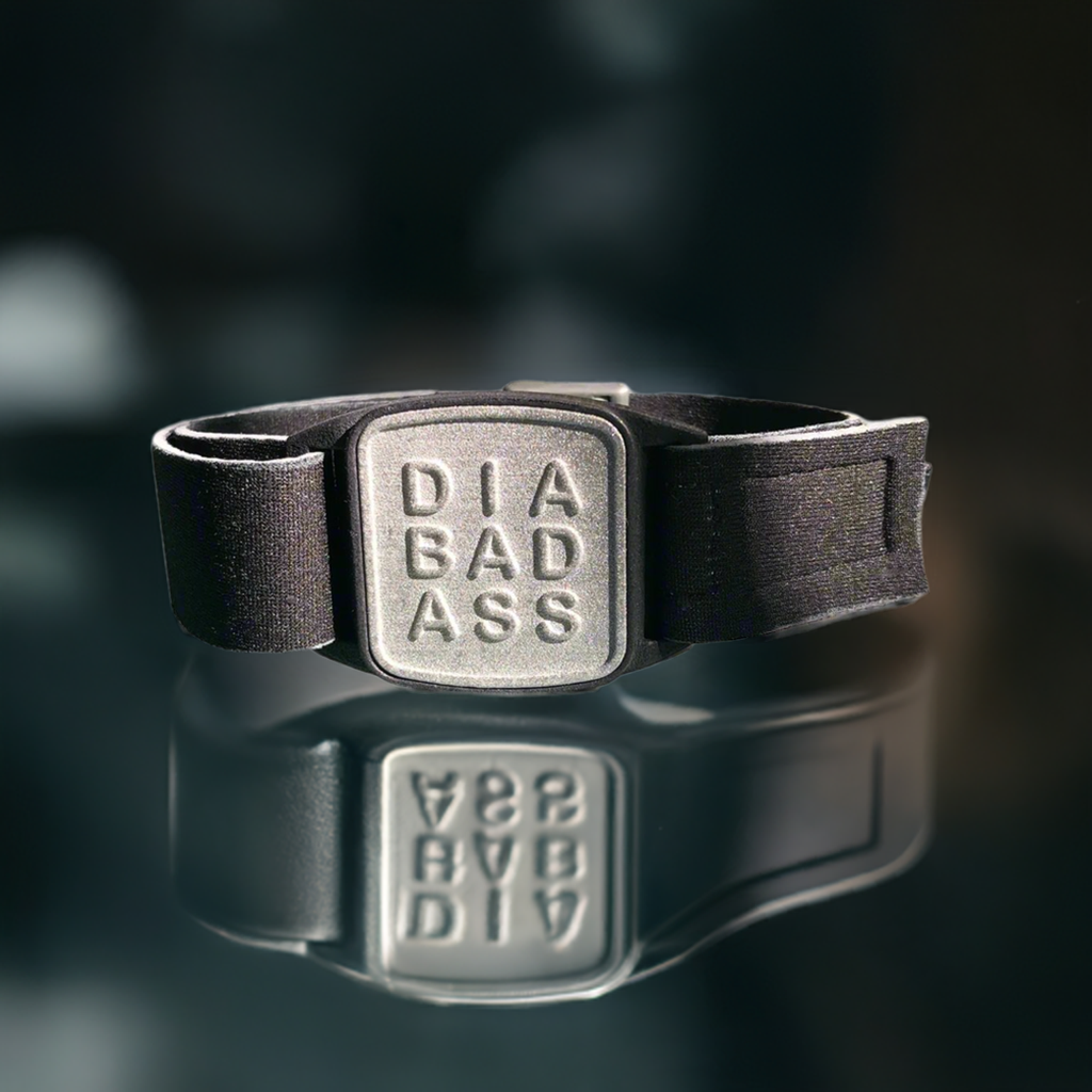 Dexband armband in pewter with DIABADASS cover. Jewellery background.