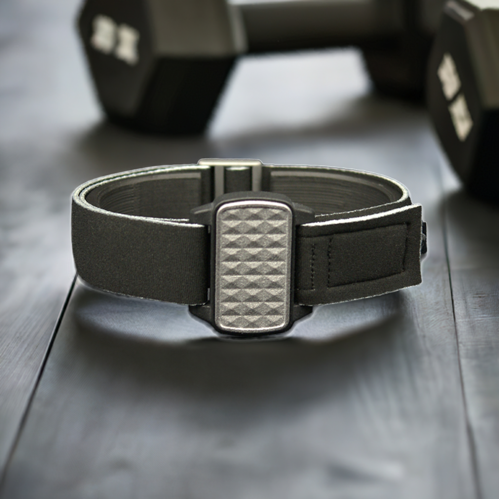 Dexband armband in pewter with pyramids cover and gym background. Black strap edged in coordinating pewter.