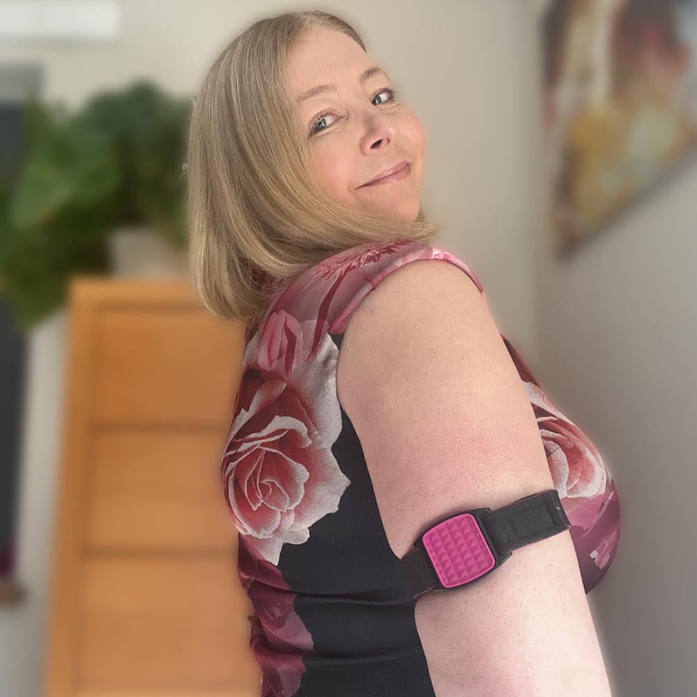 Libreband Armband for Freestyle Libre 1 &amp; 2. Magenta cover with Heart design. Shown worn by female model. LML2821, LML2814, LML2883, LML4498.