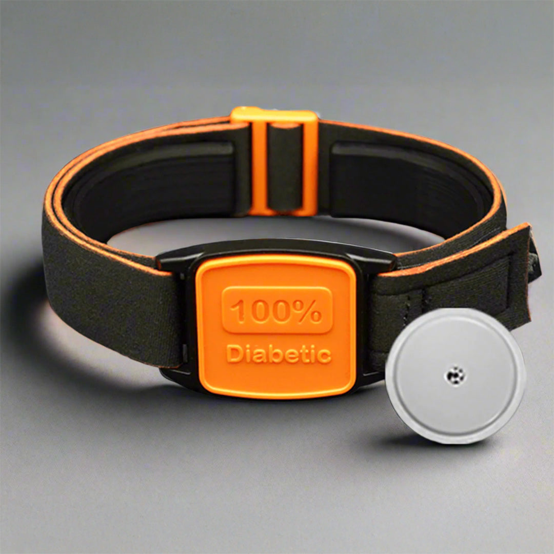 Libreband armband with orange cover and 100% Diabetic design. Black strap. Shown with Freestyle Libre 2 sensor CGM.