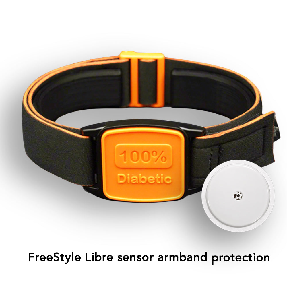 Black and orange Libreband for Freestyle Libre CGM on a wooden surface with a pool in the background.