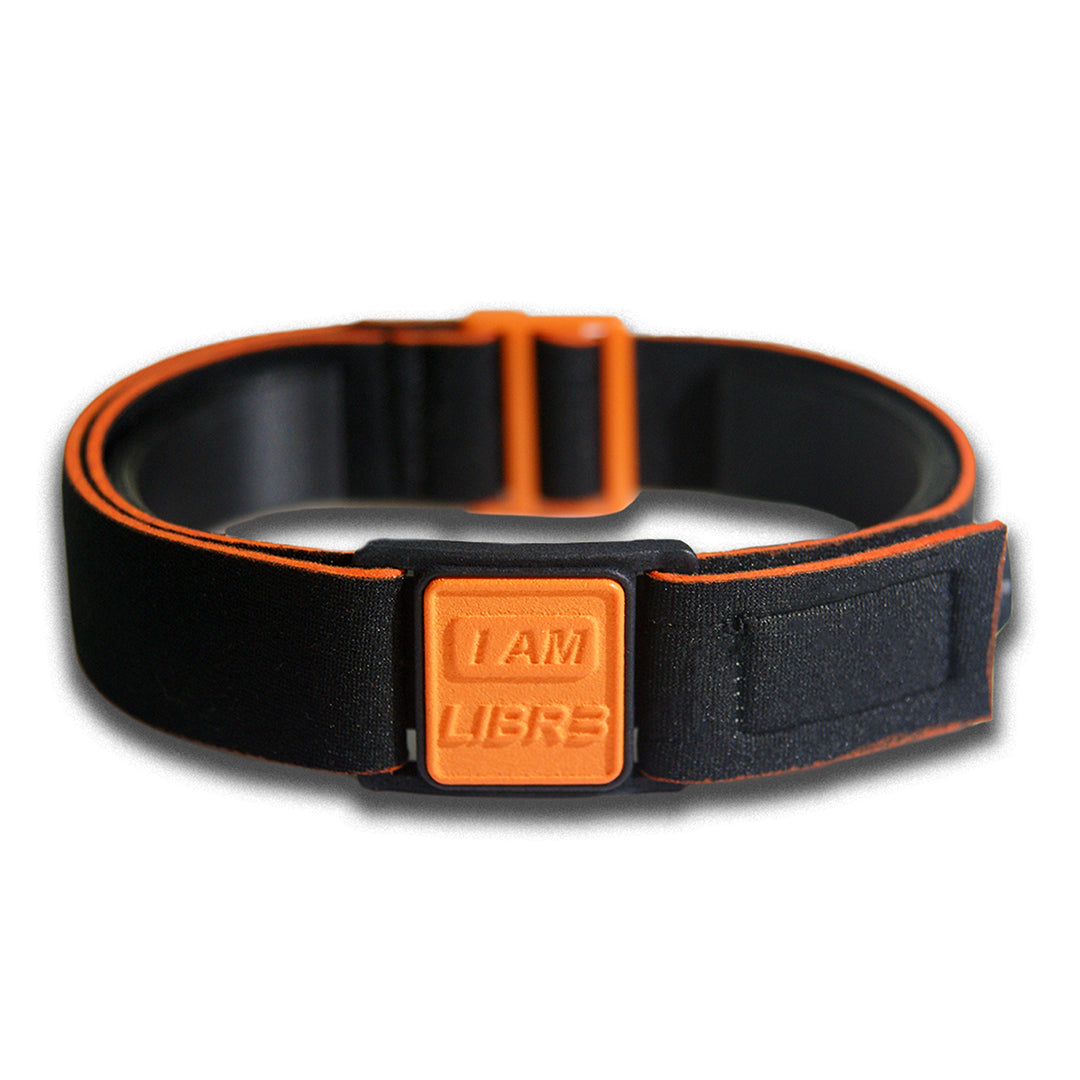 Close-up of Libreband CGM armband for FreeStyle Libre 3 with orange  I AM LIBR3 cover and water-resistant neoprene strap, for everyday wear, sport and swimming.. LML4764, LML4399, LML4382, LML4375.